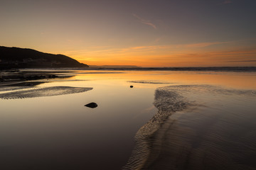 Westward Ho beach sunset afterglow on the North Devon coast of England