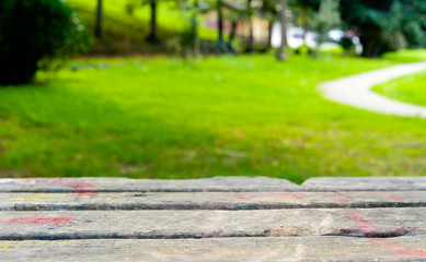 Rustic wood table foreground with natural background out of focus. Selective focus.