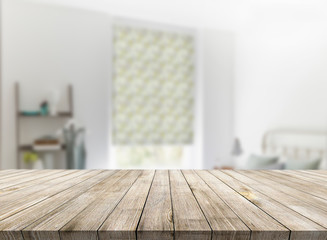 Wooden textured desk with blur interior background
