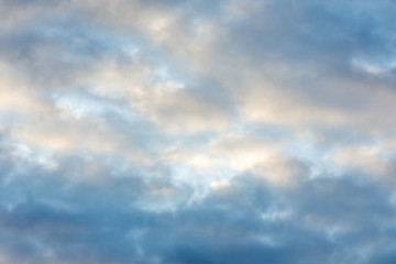 texture of the sky clouds and rays of sun on a background