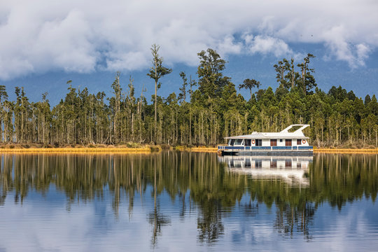 New Zealand, Grey District, Inchbonnie, Recreational boat at Lake Brunner