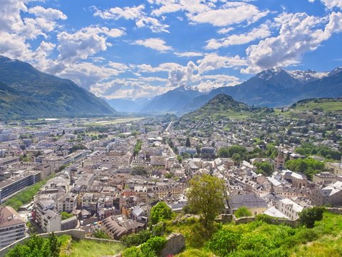 Panoramic view over the city of Sion (Sitten) and into the magnificent Rhone Valley embedded into the Swiss Alps with the Mont D'Ogre to the right