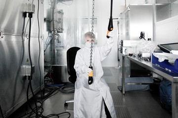 Boy in workwear in a laboratory
