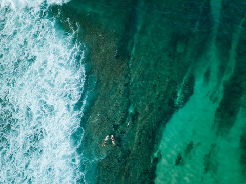 Indonesia, Sumbawa, Aerial view of surfers on sea