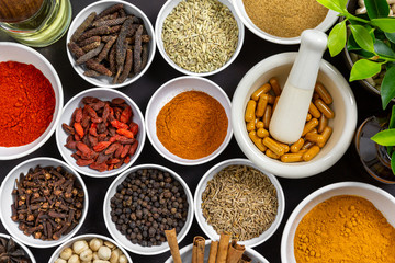 Herbal supplement in capsules with healthy medicinal plant.Alternative drug or natural pharmaceutical capsule.Medication of vitamin supplemental for care and treatment.Top view.