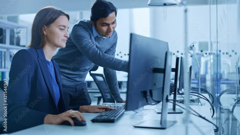 Poster modern factory office: male project supervisor talks to a female industrial engineer who works on co