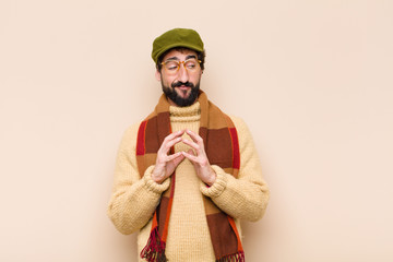 young cool bearded man scheming and conspiring, thinking devious tricks and cheats, cunning and...
