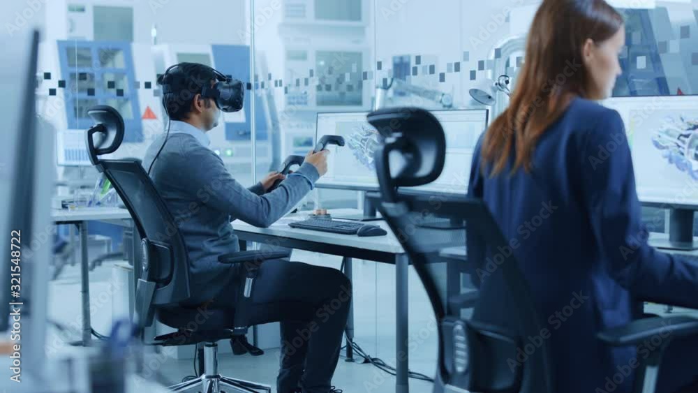 Poster Modern Factory: Industrial Design Engineer Wearing Virtual Reality Headset and Holding Controllers, Uses VR technology for Industrial Design, Development and Prototyping in CAD Software on Computer.