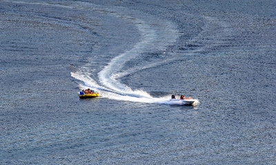 Water skiing with motorboat in the water of the sea