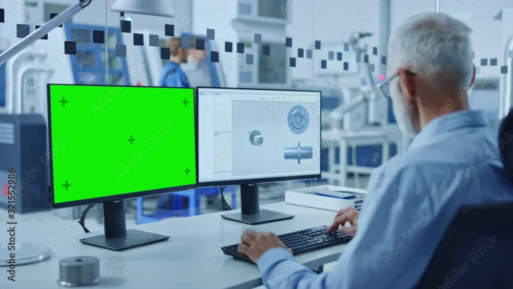 Fototapete senior heavy industry engineer working on personal computer, one is green mock-up screen, second sho