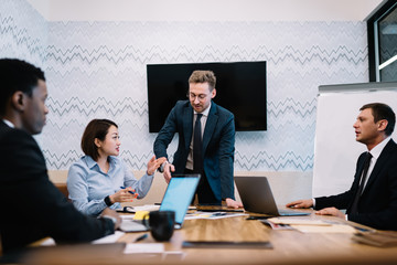 Multiethnic business partners during conference in office