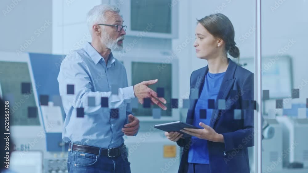 Poster modern factory: female engineer, male project manager standing in high tech development facility, ta