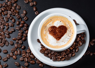 Have a good time,Topping heart white cup of coffee and spread coffee beans on