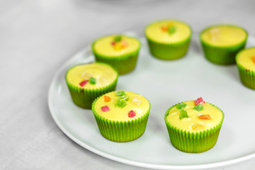 Plate with freshly baked sweet muffins. Sweet pastries, recipes, cooking