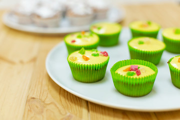 Plate with freshly baked sweet muffins. Sweet pastries, recipes, cooking