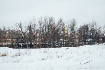 Fototapeta na wymiar snowfall on a beautiful grey winter landscape
