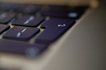 The enter key on a metallic keyboard