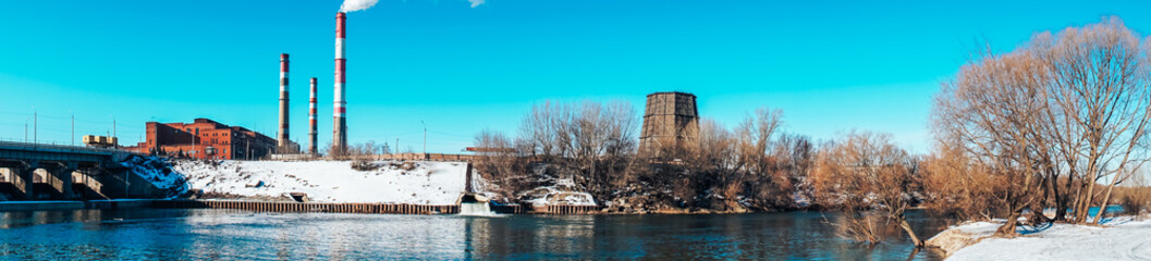 panorama of the winter snow landscape of the river and the river Bank