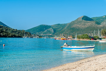 Beautiful view of the turquoise sea, boat and mountains