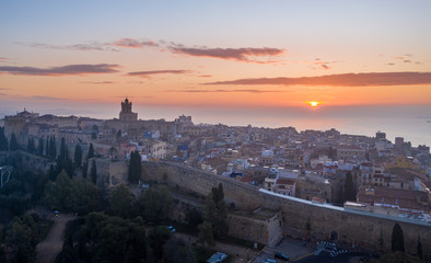 Aerial sunrise view of the medieval walled center of Tarragona in Catalunya Spain with the...