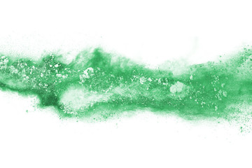 Obraz premium Green powder explosion on white background. Colored cloud. Colorful dust explode. Paint Holi.