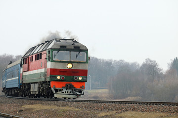 Obraz premium passenger locomotive in the city 