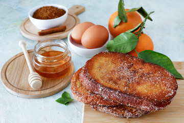 Torrijas with honey. Typical spanish dessert for Lent and Easter