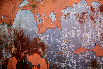 Metal rust on metal wall with rust stains, scratches and leftover color. Old metal background