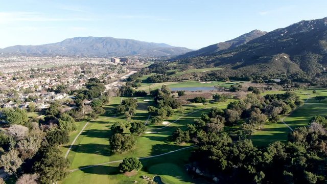 Aerial view of golf course with green field in the valley. Green turf scenery. Temecula, California, USA