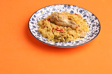 plate of rice with chicken and peppers