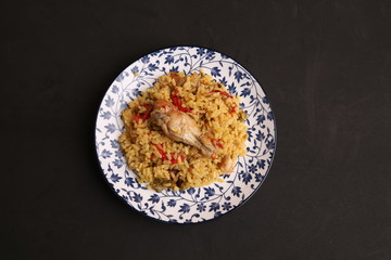plate of rice with chicken and peppers