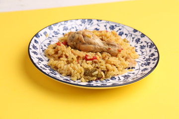 plate of rice with chicken and peppers