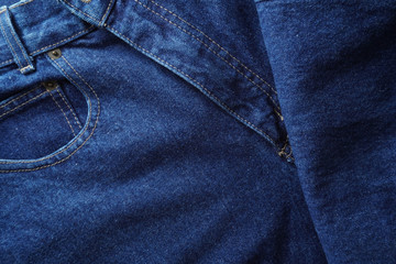 Jeans background. Denim jeans texture. Blue denim pattern.