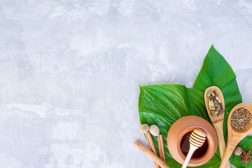 Top view of set for relaxing healing thai spa treatments, massage. Pot with honey, wooden spoons...