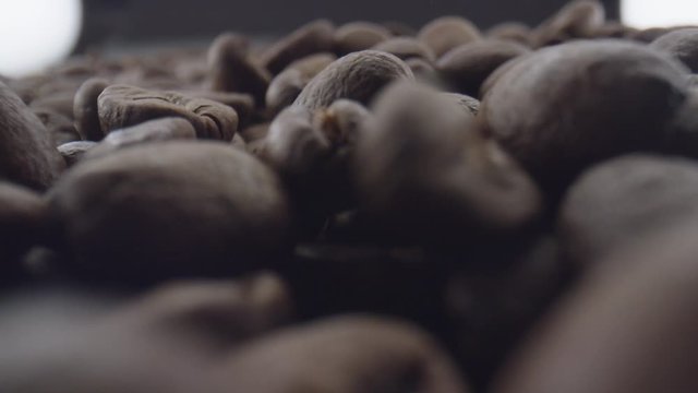 Macro extreme close up of coffee beans falling