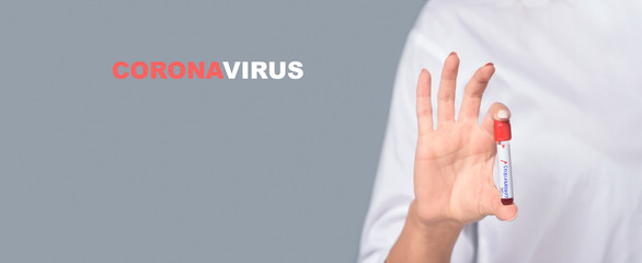 Nurse holding a positive blood test result for the new rapidly spreading Coronavirus. Text phrase...