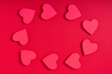 Valentine hearts on red surface. Top view, flat lay, from above, copy space