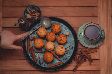Cupcakes and tea prepared by women's labor.