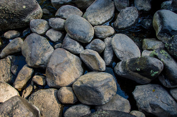 grey rock around a river