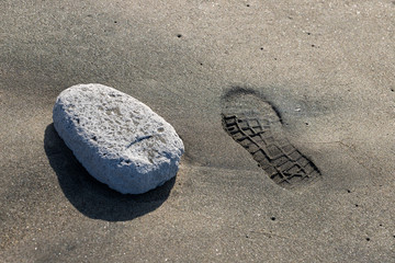 Fototapeta na wymiar Sandy Footprint At Sunrise
