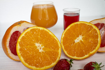 Fresh fruits. Healthy food. Mixed fruit, Oranges and strawberries. Studio photography of various fruits on an old wooden table. Organic healthy assorted fruits. Assortment of fresh fruit. Fruit food b