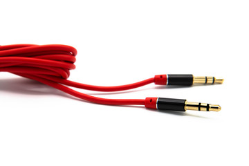 Red audio cable aux isolated on white background - obrazy, fototapety, plakaty