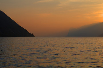 Naklejka na ściany i meble sunset at the lake,water, sky,view,nature,mountains, orange,light, cloud, dawn, 