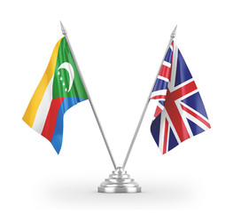 United Kingdom and Comoros table flags isolated on white 3D rendering