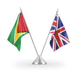 United Kingdom and Guyana table flags isolated on white 3D rendering