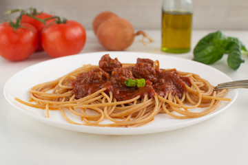 Whole grain spaghetti with complex carbohydrates on a white background. Healthy food.