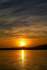 Naklejka premium a romantic sunset on Lake Pusiano in Italy. 