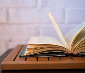 Open book turning the pages on a white background.