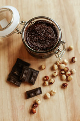 Chocolate paste with nuts on a wooden table. top view. Sweet dessert. Healthy diet