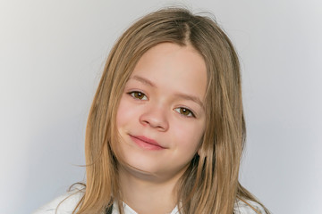 Young girl posing in front of the camera